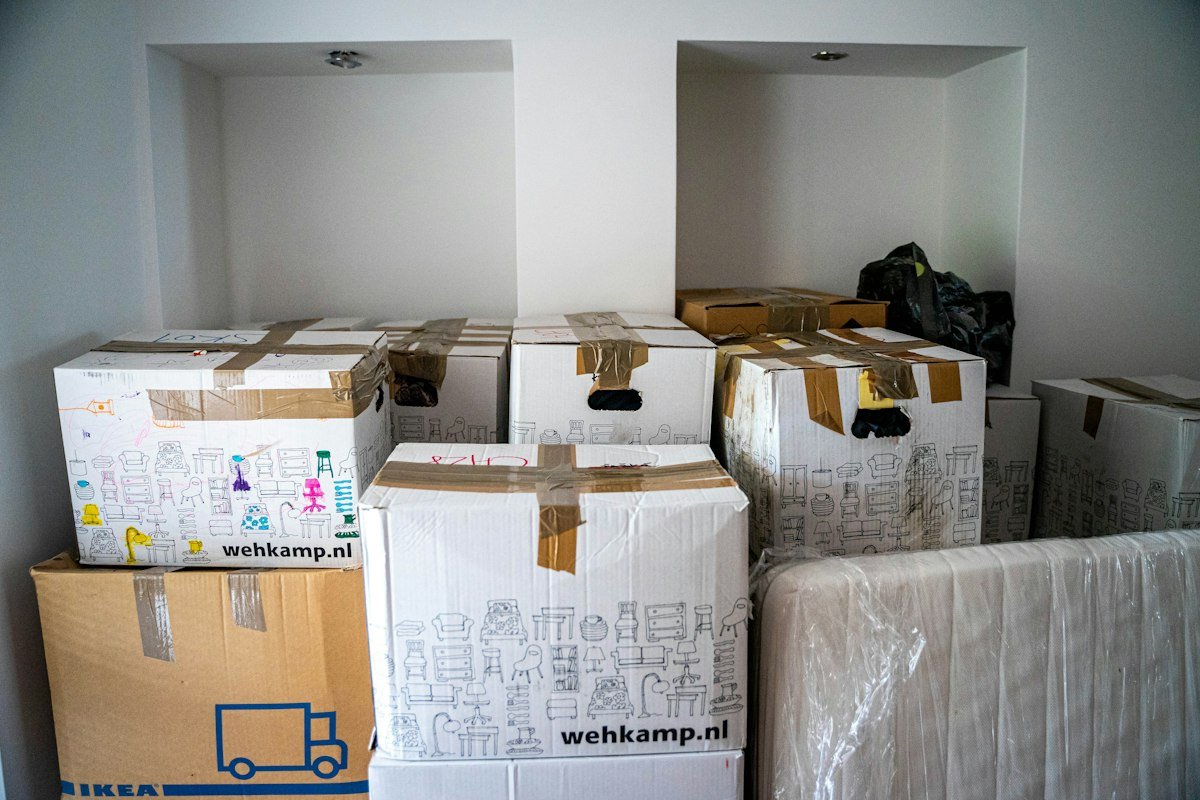 Brown cardboard moving boxes on a wooden table