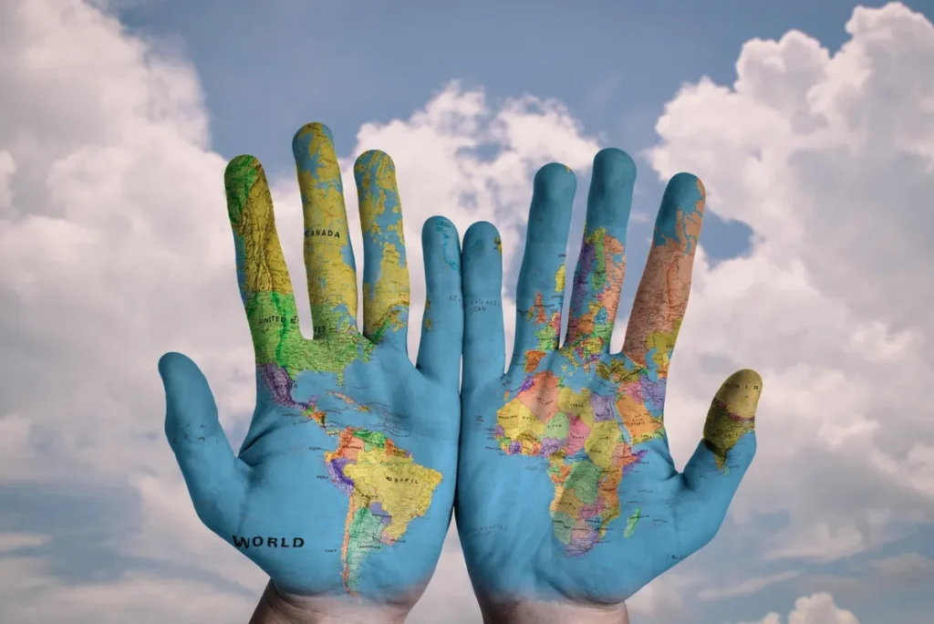 Faced by international students: hands, world and world map