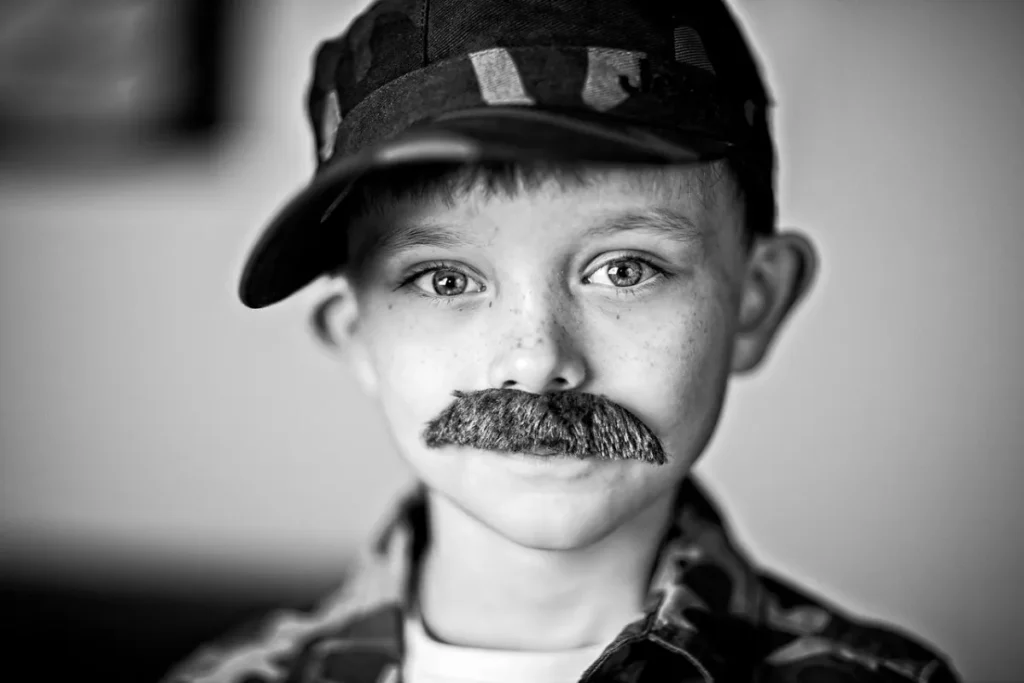 Fake job: boy, fake mustache and portrait