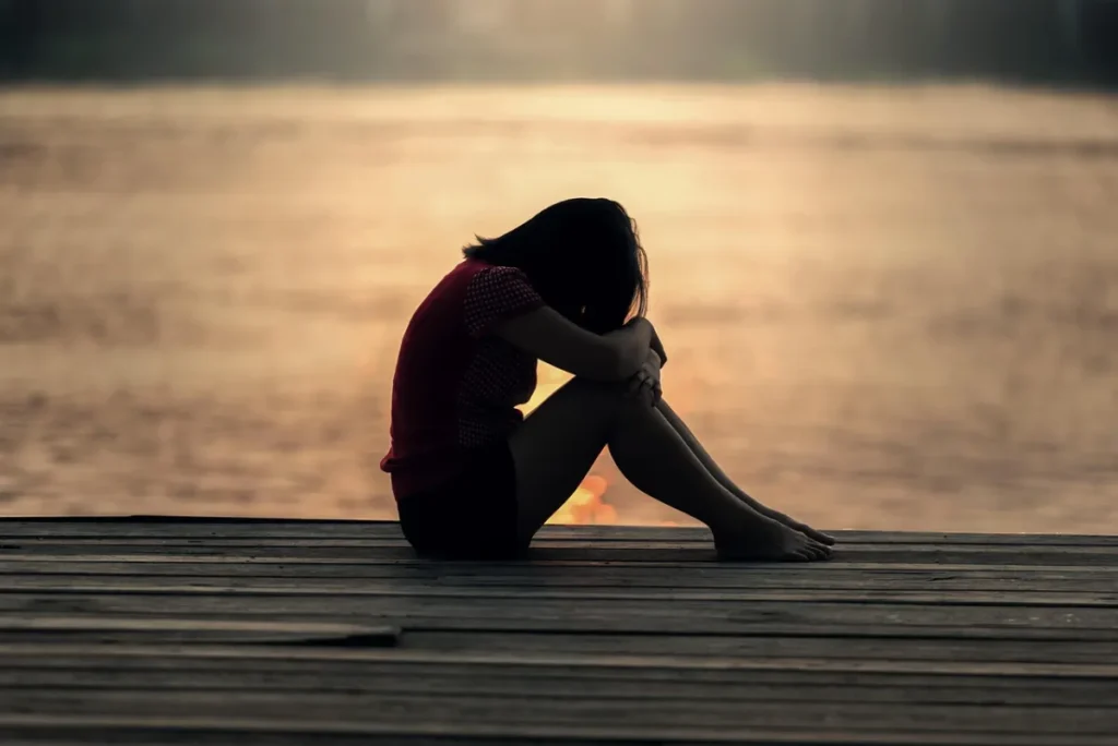 Girl, sitting and jetty