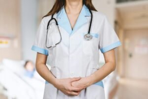 Nurse in a white shirt with a blue stethoscope